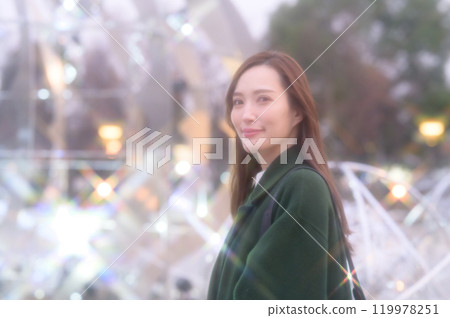 A woman enjoying winter illuminations A woman enjoying winter illuminations 119978251