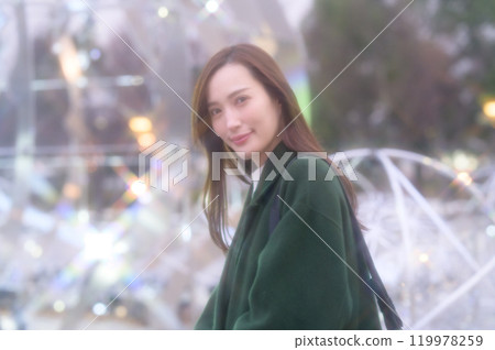 A woman enjoying winter illuminations 119978259