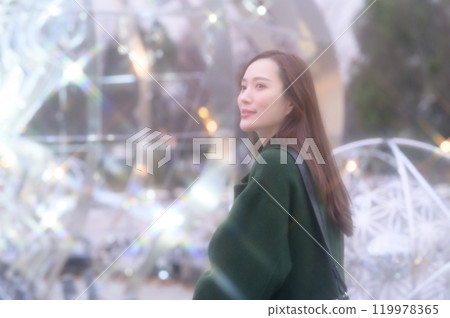 A woman enjoying winter illuminations A woman enjoying winter illuminations 119978365