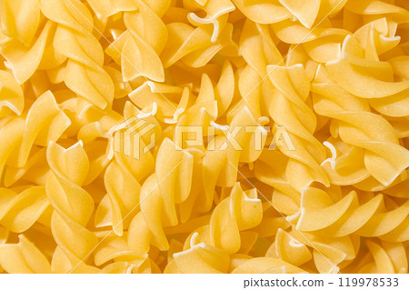 Uncooked Fusilli Pasta Background 119978533