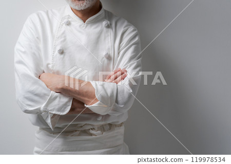 Body parts of a male chef with his arms crossed Body parts of a male chef with his arms crossed 119978534