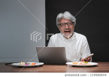 Chef happy to see a computer Chef happy to see a computer 119980644