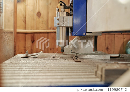 Drilling holes in steel board or detail 119980742