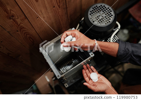 Processing white plastic bottle caps 119980753