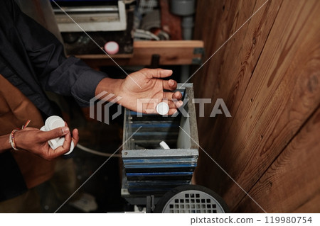 Putting caps into processing equipment 119980754
