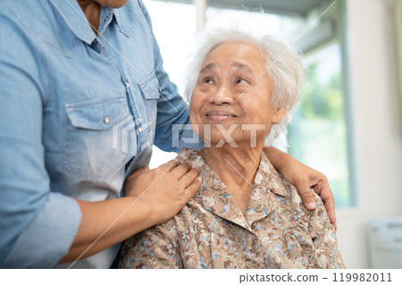 Caregiver help and care Asian senior woman patient with love, encourage and empathy in hospital. Caregiver help and care Asian senior woman patient with love, encourage and empathy in hospital. 119982011