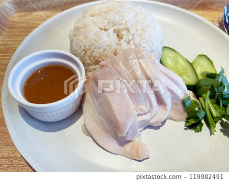 Khao Man Gai (Hainanese Chicken Rice): A classic Thai chicken rice dish. 119982491