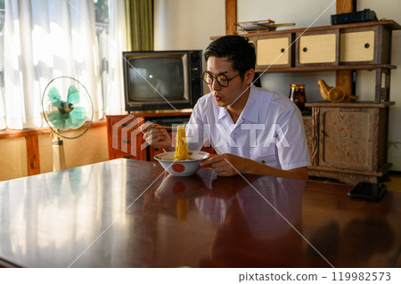 Man eating ramen Man eating ramen 119982573