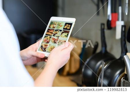 Portrait of a man wearing an apron Portrait of a man wearing an apron 119982813