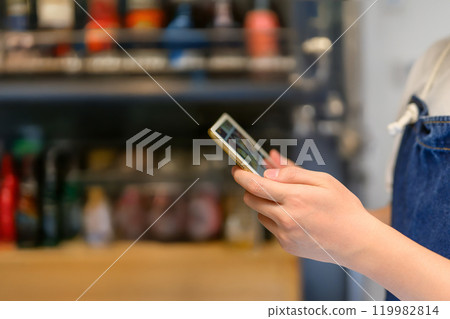 Portrait of a man wearing an apron 119982814