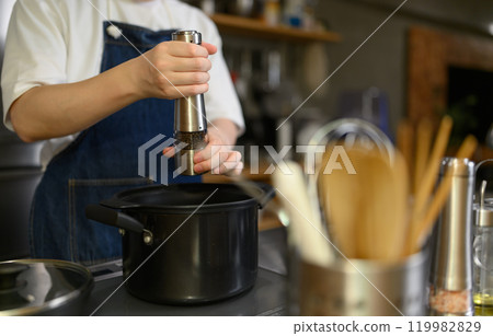 Portrait of a man wearing an apron Portrait of a man wearing an apron 119982829