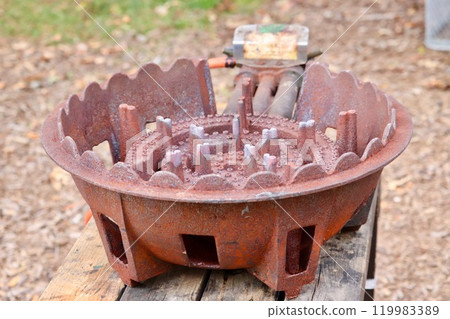 Rusty cast iron gas stove 119983389