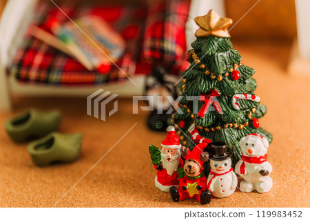 A winter display of miniature Christmas trees and little Santas 119983452