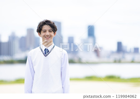 Male student standing looking at the camera Male student standing looking at the camera 119984062