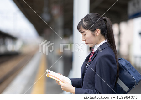 High school girl studying at the station High school girl studying at the station 119984075