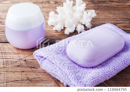 Spa and Wellness concept on wooden background. Soap and Terry towel. Spa and Wellness concept on wooden background. Soap and Terry towel. 119984795