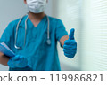 Healthcare Professional Giving Thumbs Up with Protective Gloves and Mask 119986821