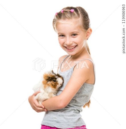 Cute little girl holding a guinea pig. Isolated on white background. 119986963