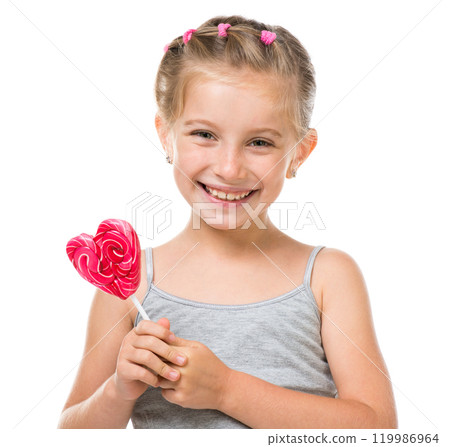 Adorable little girl with red lollipop in heart shape isolated over white background Adorable little girl with red lollipop in heart shape isolated over white background 119986964