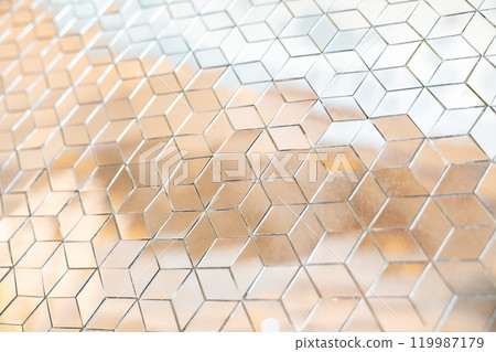 Shiny mirror cut in a cube shape for decorating wall and floor, laying mirror tile in 3d cube geometric pattern. 119987179
