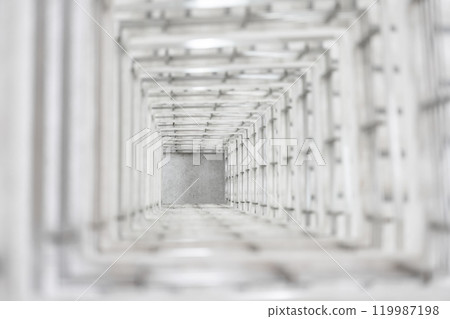 Top angle view of the white reinforced steel bar framework column construction in the work site. 119987198