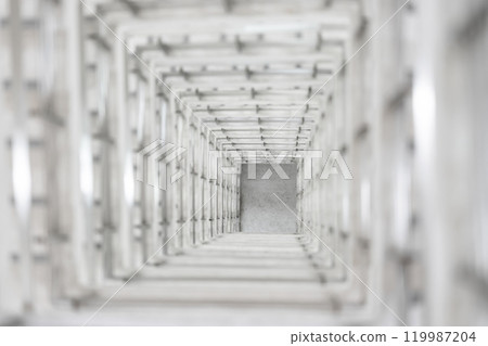 Top angle view of the white reinforced steel bar framework column construction in the work site. 119987204