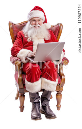 Santa Claus is comfortably sitting in a chair while using a laptop 119987264