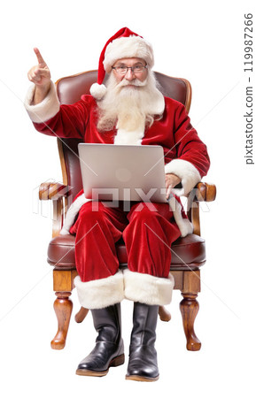 Santa Claus sits in a chair with a laptop, pointing excitedly 119987266