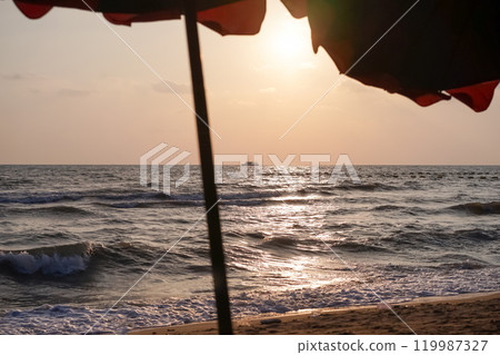 The beautiful scene of Pattaya beach and sea waves with the golden sun and white clouds on the clear sky in the daytime, Thailand. 119987327