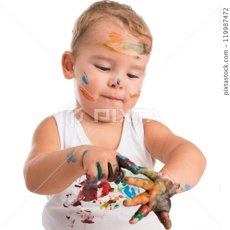 funny little boy painting his hands isolated on white background 119987472