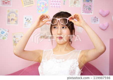 Young woman in wedding dress (Fancy photo props room) Young woman in wedding dress (Fancy photo props room) 119987598