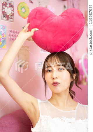 Young woman in wedding dress (Fancy photo props room) Young woman in wedding dress (Fancy photo props room) 119987633