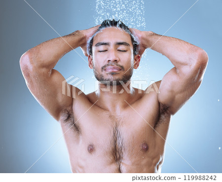 Shower, hair care and face of man with water splash for hygiene, grooming or shampoo on studio background. Wash, body and Asian model with eyes closed for treatment, wellness or morning routine 119988242