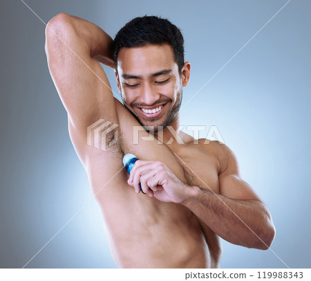 Man, deodorant and armpit in studio for wellness, hygiene and happy for self care with pride. Smile, scent and male person by white background for dermatology, cosmetics and skincare in morning Man, deodorant and armpit in studio for wellness, hygiene and happy for self care with pride. Smile, scent and male person by white background for dermatology, cosmetics and skincare in morning 119988343