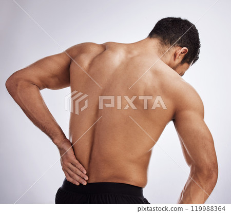 Injury, topless man and holding back pain for spinal stenosis, hurt or training sprain in studio white background. Male person, emergency and body crisis with stress for self care and medical health 119988364