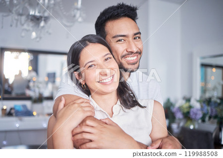Home, happy couple and hug in portrait for love, bond and commitment in marriage. Married people, man and woman in apartment with support, romance and affection with trust of husband and wife 119988508