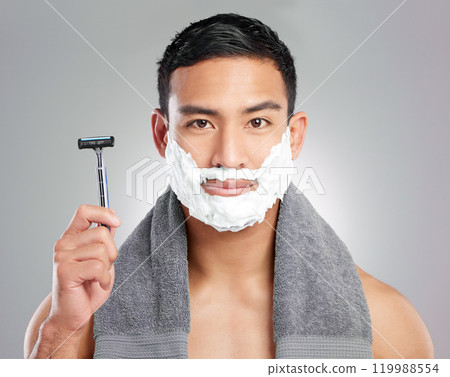 Man, portrait and razor or beard with shaving cream on white background, grooming or hair removal. Male person, face and hygiene tool in studio for morning routine or skincare, treatment or cleaning Man, portrait and razor or beard with shaving cream on white background, grooming or hair removal. Male person, face and hygiene tool in studio for morning routine or skincare, treatment or cleaning 119988554