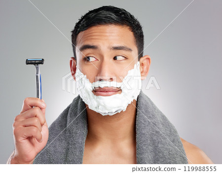 Asian man, razor and beard with shaving cream or hair removal grooming, cleaning or grey background. Male person, thinking and skincare tool in studio for healthy hygiene, morning routine or bathroom Asian man, razor and beard with shaving cream or hair removal grooming, cleaning or grey background. Male person, thinking and skincare tool in studio for healthy hygiene, morning routine or bathroom 119988555