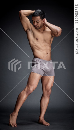 Fitness, asian man and bodybuilder in underwear flexing abs and strong body for calisthenic exercise in studio. Sexy, male person and confidence with stomach muscles from training and workout goal Fitness, asian man and bodybuilder in underwear flexing abs and strong body for calisthenic exercise in studio. Sexy, male person and confidence with stomach muscles from training and workout goal 119988788