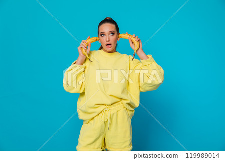 The woman put bananas in her ears 119989014