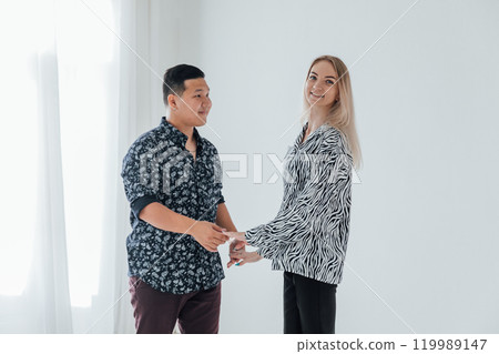 Man and woman dancing together to bachata music 119989147