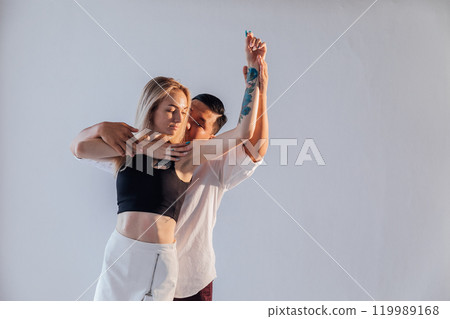 Man And Woman Dancing Together To Bachata Salsa Music Man And Woman Dancing Together To Bachata Salsa Music 119989168