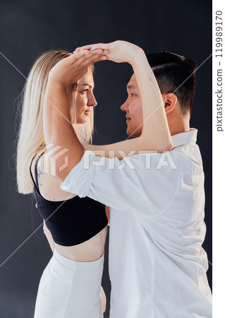 Man And Woman Dancing Together To Bachata Salsa Music 119989170