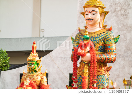 Majestic statue of Thao Wessuwan, the Asian deity of wealth and protection, showcased in the sacred surroundings of Wat ThepLeeLa temple in Bangkok, Thailand. 119989357