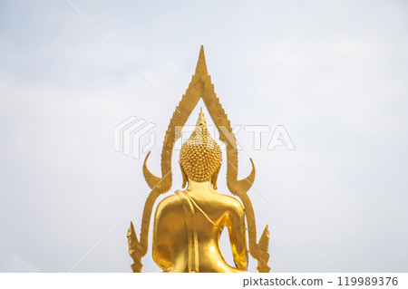 A stunning golden Buddha sculpture, exemplifying the deep reverence and devotion of Thai individuals in their spiritual worship. A stunning golden Buddha sculpture, exemplifying the deep reverence and devotion of Thai individuals in their spiritual worship. 119989376