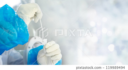 Close up to the rubber gloves on the asian medical staff is processing coronavirus or covid-19 test in the negative room pressure. Close up to the rubber gloves on the asian medical staff is processing coronavirus or covid-19 test in the negative room pressure. 119989494
