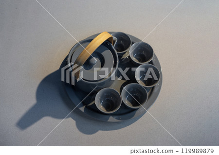 TeaPot ceramic set with New contemporary Modern and Vintage combination style on flat stone kitchen counter with sunlight from window. 119989879