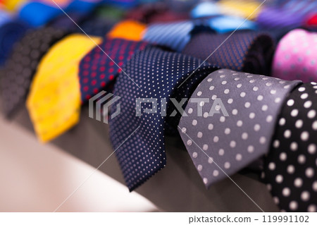 Ties on hangers in men clothing store Ties on hangers in men clothing store 119991102