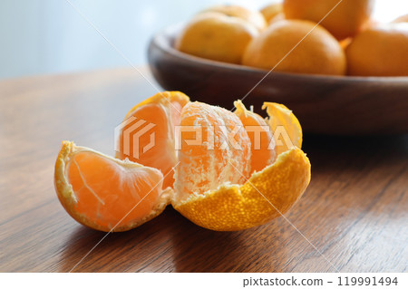 Peeled tangerines on the table 119991494