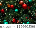 Background of red, green, orange balls toys and lights on green indoor Christmas tree on New Year 119991599